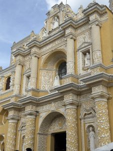 Detailed view of a historic church facade with ornate columns and decorative sculptures.
