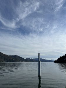 View of the Cannobio pier with a view of the Italian mountains