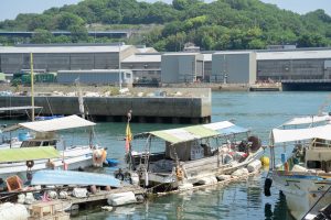 A small fishing port on the Onomichi Channel in Onomichi. A scenic view of old fishing boats lined up, giving a sense of history.