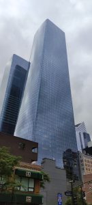 Big skyscrappers in a city and blue skyes. 