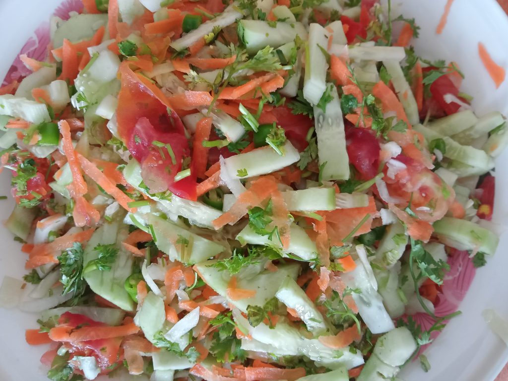 Green Salad served in a white plate