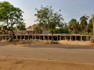 Archaeological stone structures and pillared ruins at the Hampi UNESCO World Heritage Site, India.