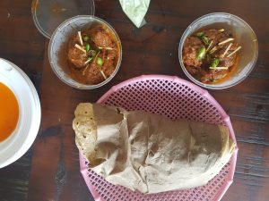 Chicken Qorma served with fresh wheat roti
