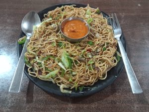 A plate full of veg chowmein in a Nepali restaurant in Butwal, Nepal 