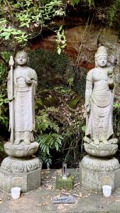 Statues of Kōbō Daishi (Kūkai) and Kannon (Avalokiteśvara) in Todoroki Valley, Tokyo, with Kōbō Daishi on the left and Kannon on the right.