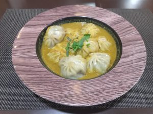 A bowl full of Jhol Momos (Nepalese Soup Dumplings) at a restaurant in Kathmandu, Nepal 