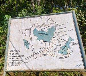A hand-painted outdoor tourist map sign in Nepal displaying the area around Begnas Lake and Rupa Lake.