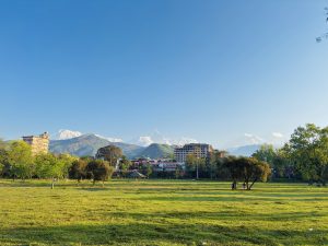 Pokhara city with snow-capped Annapurna range under clear blue sky #NepalPhotoFestival2026