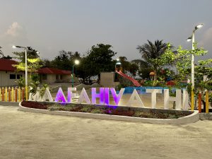 An island name sign with local inhibit shot at night 
