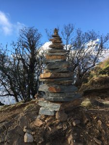 Balanced stones, snowy peaks, and endless peace.