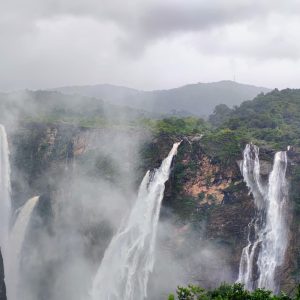 

Majestic Joga waterfalls cascade down rugged cliffs amidst lush green forests