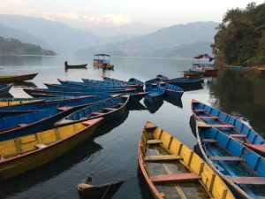 At Begnas Lake, the colorful boats wait in silence, gently swaying with the breeze, ready to carry travelers across calm waters and into moments of peace.  #BegnasLake #NepalBeauty #Pokhara