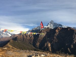 Nepal’s flag and the towering Himalayas - symbols of courage, beauty, and pride.