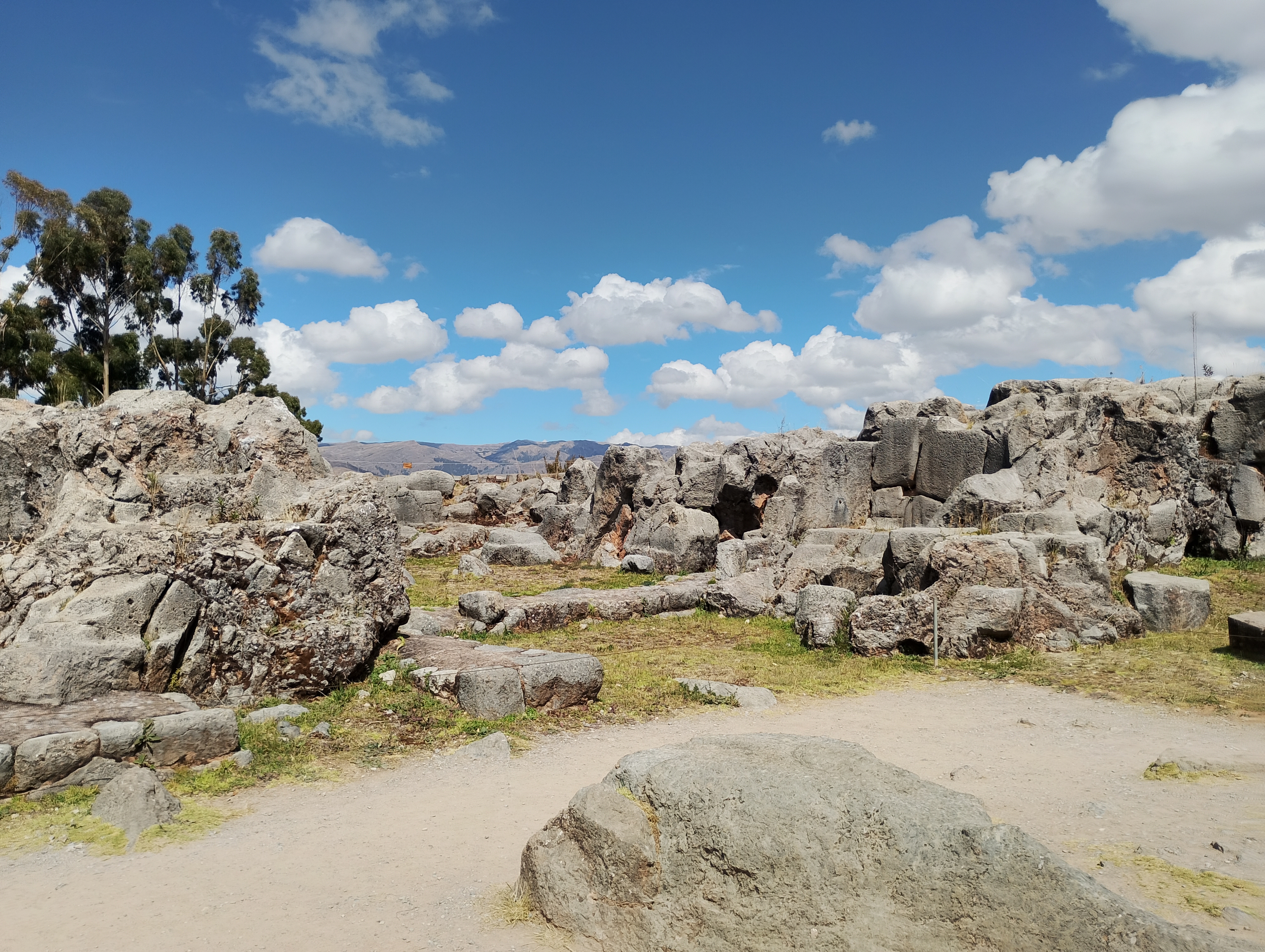 Partially carved rock formations at the Qenqo Inca archaeological site near Cusco, showing natural stone shaped by the Incas.