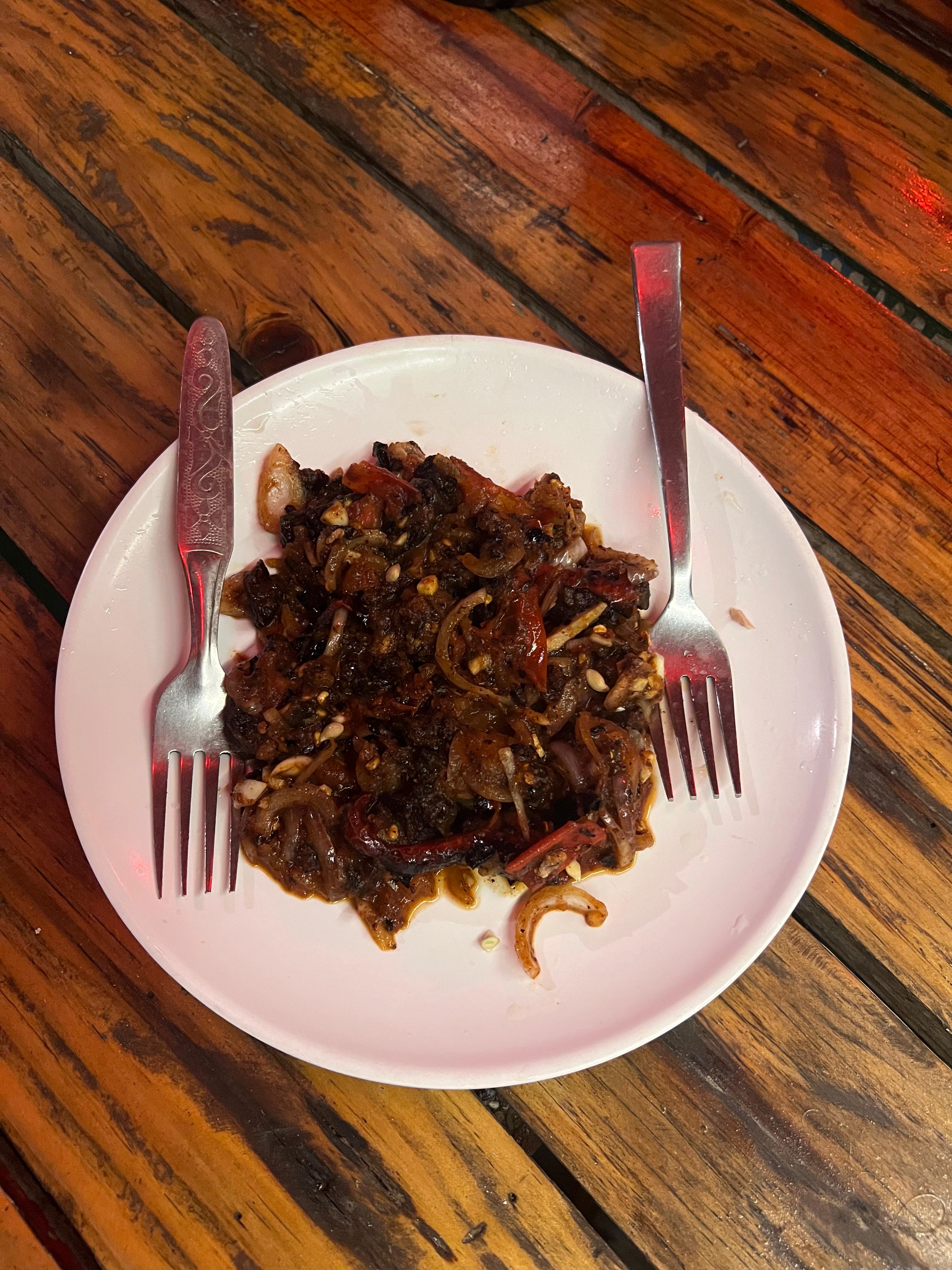 Buff choila served with fork and spoon on the plate on the table