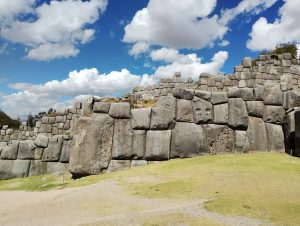 Massive Inca stone walls at Sacsayhuaman near Cusco, Peru, with large precisely fitted stone blocks.