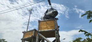 Decorative helicopter mounted on log-built platform