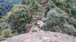 Rudkhan Castle Seen from the West Tower
A high-angle view of Rudkhan Castle from the top of the west tower, showing the stone stairways, terraced walls, and forested mountain landscape of northern Iran.
Alt text: View from the west tower of Rudkhan Castle overlooking stone walls, winding stairs, and dense green forest in Gilan Province, Iran
