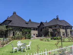Front view of Adisham Bungalow surrounded by gardens in Haputale, Sri Lanka