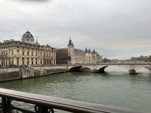 Historic Conciergerie and Pont au Change spanning the Seine River in Paris, France.