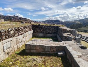 Remains of a large Inca building at Sacsayhuaman, near Cusco, Peru. The structure's stone foundation is preserved with carefully fitted blocks.
