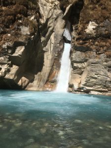 A stunning natural waterfall cascading through lush greenery, where the soothing sound of flowing water and the beauty of untouched nature create a truly peaceful escape.
