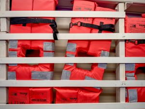 Orange life jackets photographed in the ceiling of the ferry to Liberty Island, New York City.