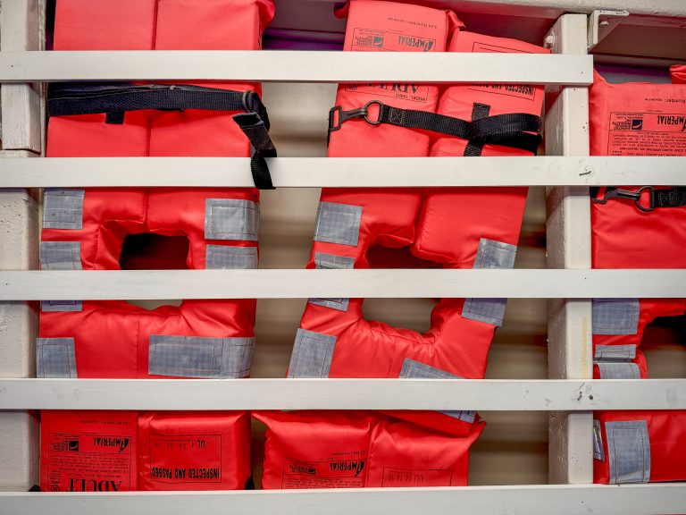 Orange life jackets photographed in the ceiling of the ferry to Liberty Island, New York City.