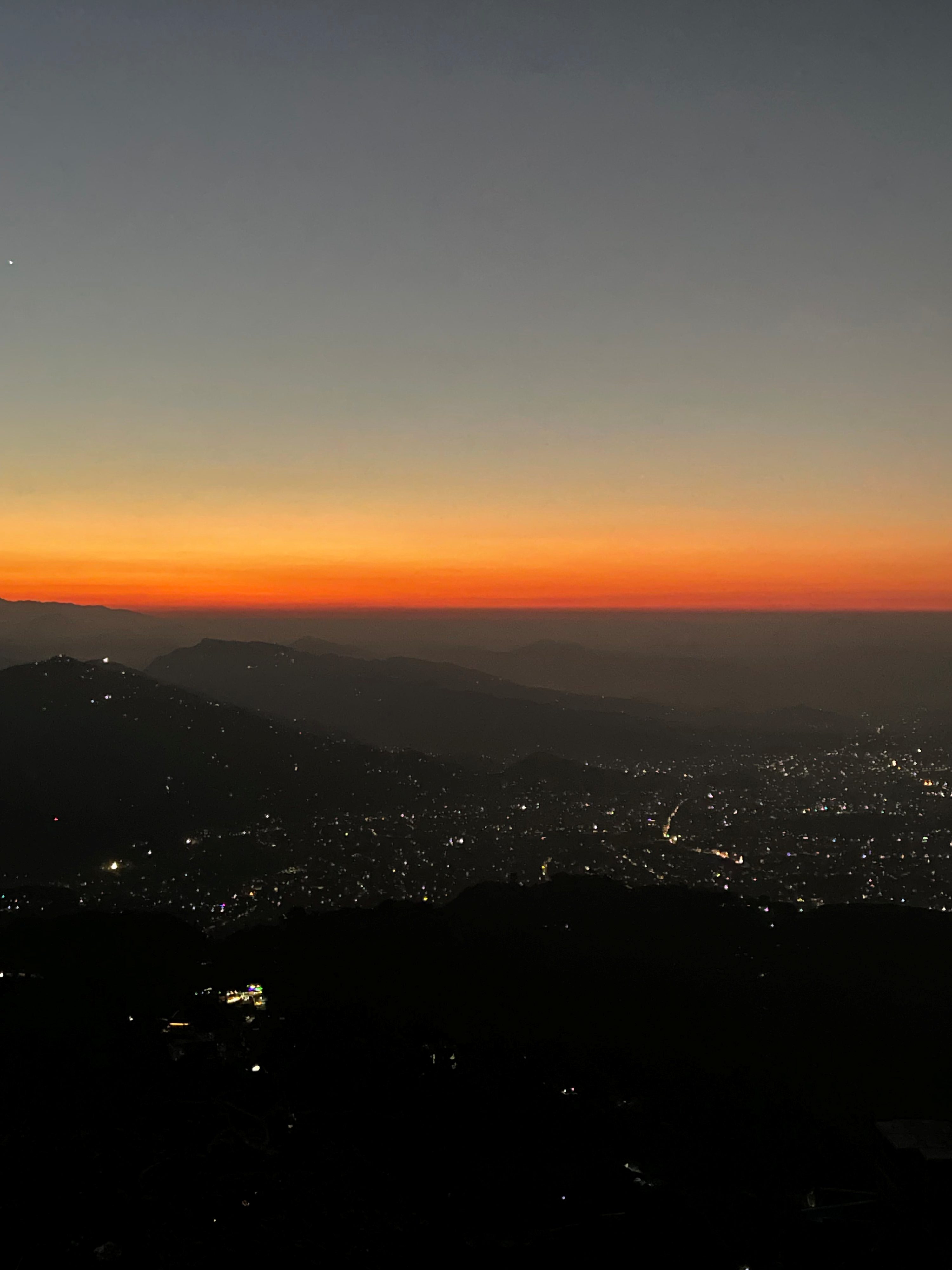 Orange sky over Sarangkot at sunset.