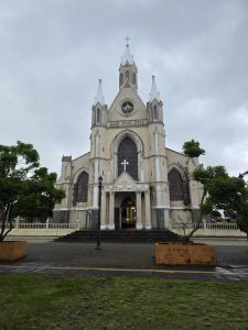 Church with a clock tower on its facade, showing classic architectural design