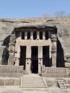 The impressive entrance of one of the Kanheri Caves showcases finely carved stone pillars, decorative details, and centuries-old craftsmanship. This historic façade reflects the rich Buddhist heritage of the site. Captured at Sanjay Gandhi National Park, Borivali East, Mumbai. 