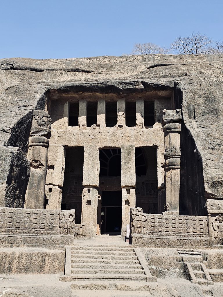 The impressive entrance of one of the Kanheri Caves showcases finely carved stone pillars, decorative details, and centuries-old craftsmanship. This historic façade reflects the rich Buddhist heritage of the site. Captured at Sanjay Gandhi National Park, Borivali East, Mumbai.