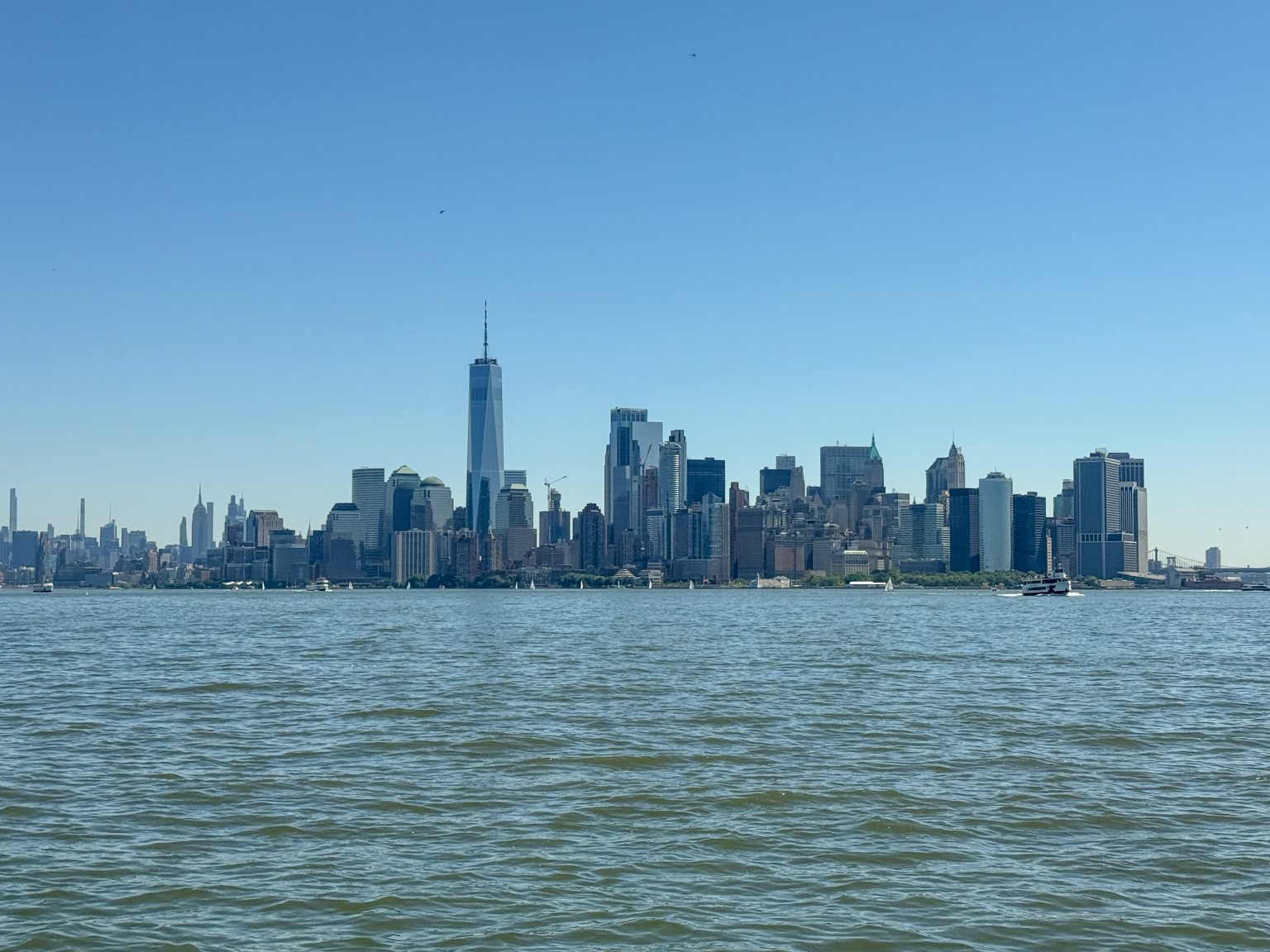 The New York City skyline as seen from a ferry in New York Harbor.