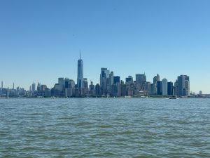 The New York City skyline as seen from a ferry in New York Harbor.
