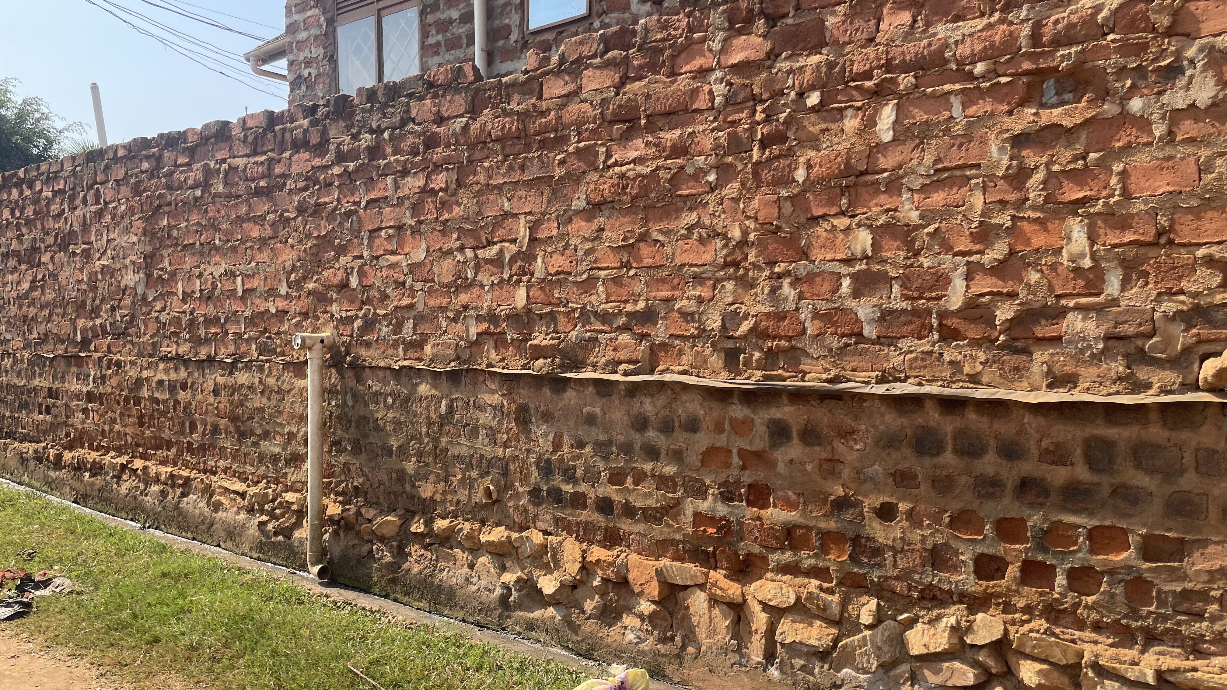 A brick and mortar wall in Kampala city