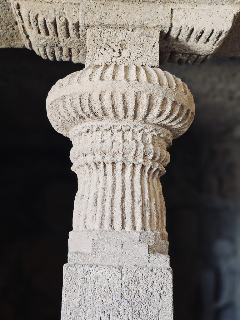 A close-up of a beautifully carved stone pillar reveals the fine craftsmanship preserved at Kanheri Caves. The detailed patterns show the skill of ancient artisans who carved these monuments from solid rock. Captured at Sanjay Gandhi National Park, Borivali East, Mumbai.