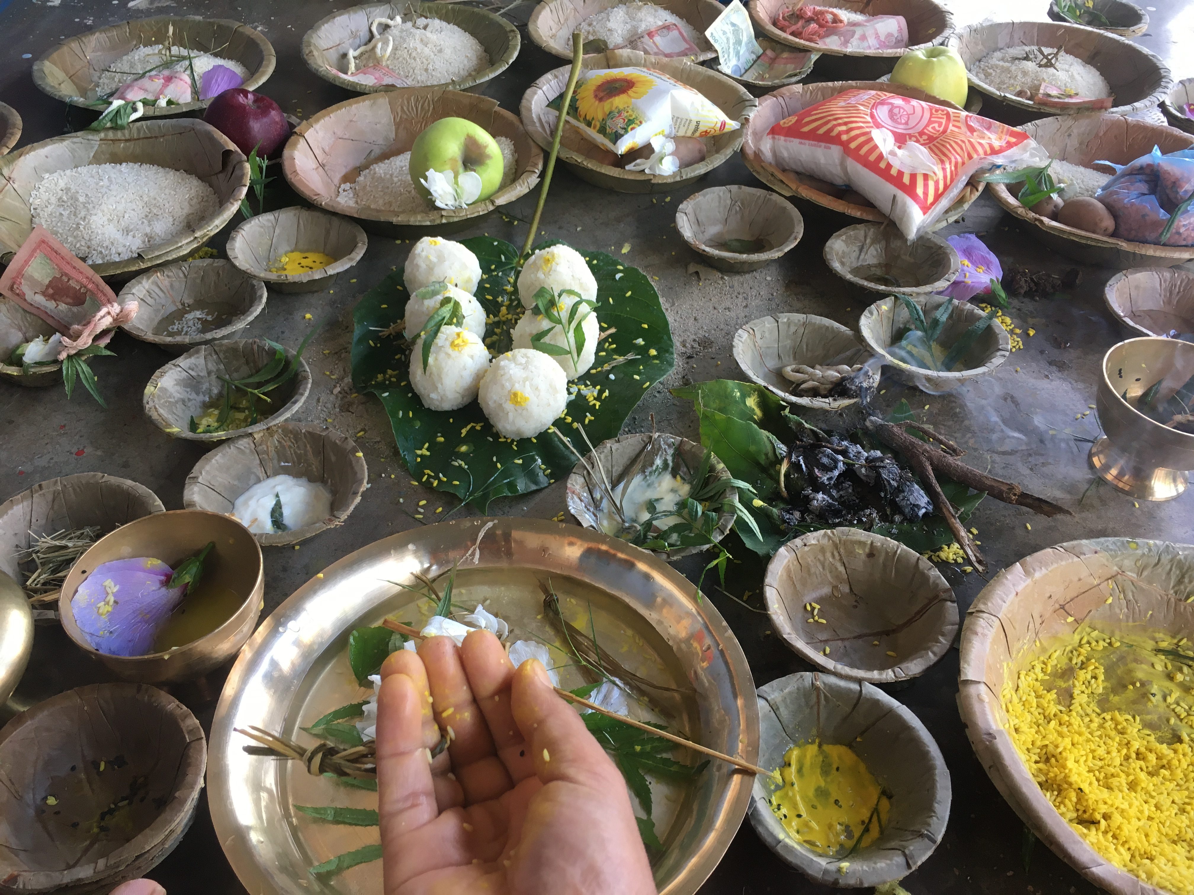 Honoring ancestors through the traditional Nepali ritual of Pitri Puja, performed with devotion and sacred offerings.