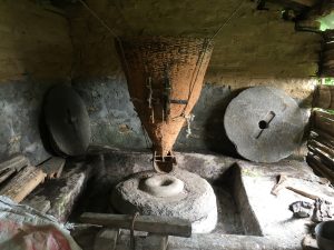 A traditional water mill (Pani Ghatta) powered by the flowing stream, reflecting Nepal’s rich rural heritage, sustainable living, and the timeless harmony between nature and human ingenuity.
