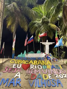 
Colorful sand sculpture with Rio de Janeiro and Copacabana designs, flags, and palm trees.