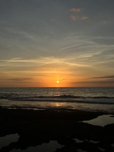 Warm orangey sunset in a beach.