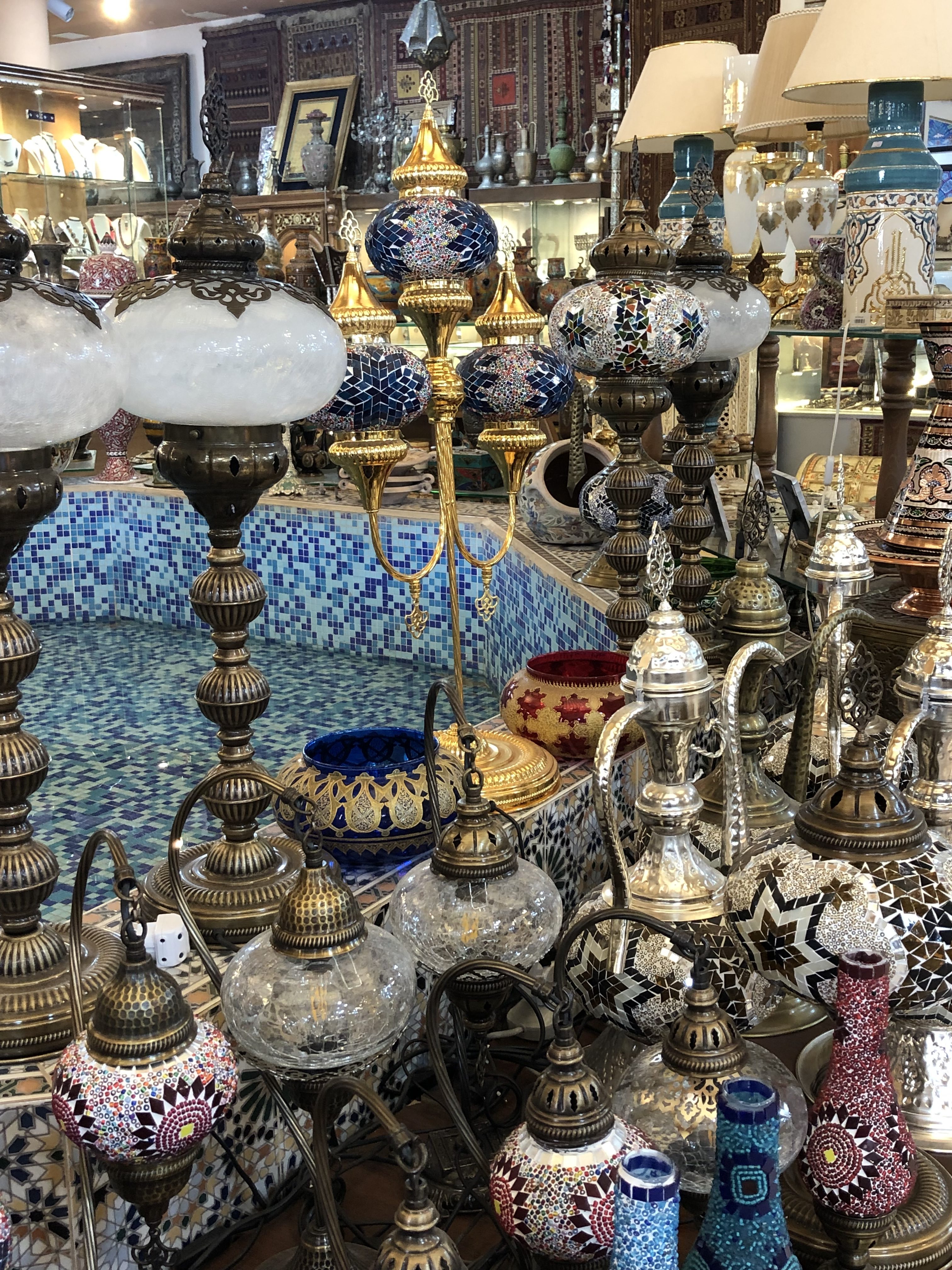 Colorful decorative lamps displayed in a market.