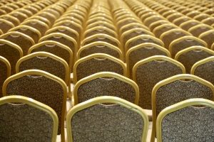Rows of gold-colored chairs filling the entire frame.
