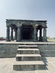 The open pillared hall features massive stone columns supporting a flat roof, creating a peaceful and timeless atmosphere. The simple yet elegant design reflects the temple’s architectural brilliance. Captured at the Lakkundi (Lokkugundi) Temple Complex, Gadag district, Karnataka.
