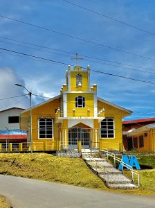 
A yellow wooden building.