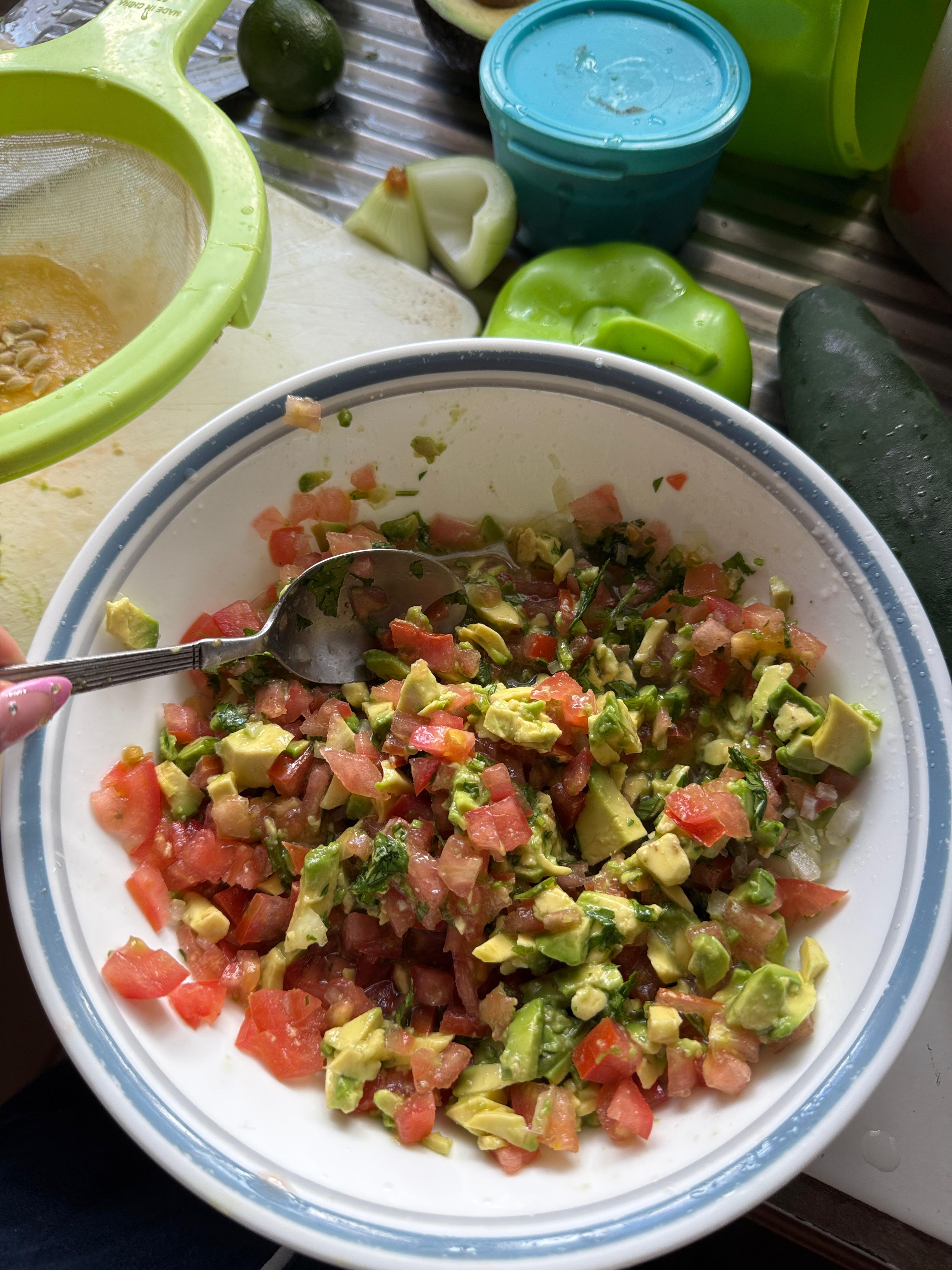 A bowl of Costa Rican chimichurri salad served with grilled meat.