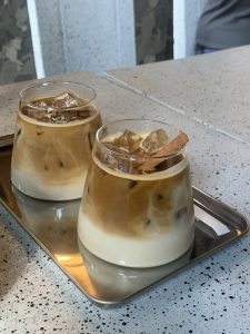 Spanish latte is a popular flavor for a coffee. The cinnamon topping adds more aroma and wraps up the presentation of the café menu.