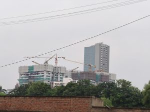 A view of a construction site featuring multiple high-rise buildings. 