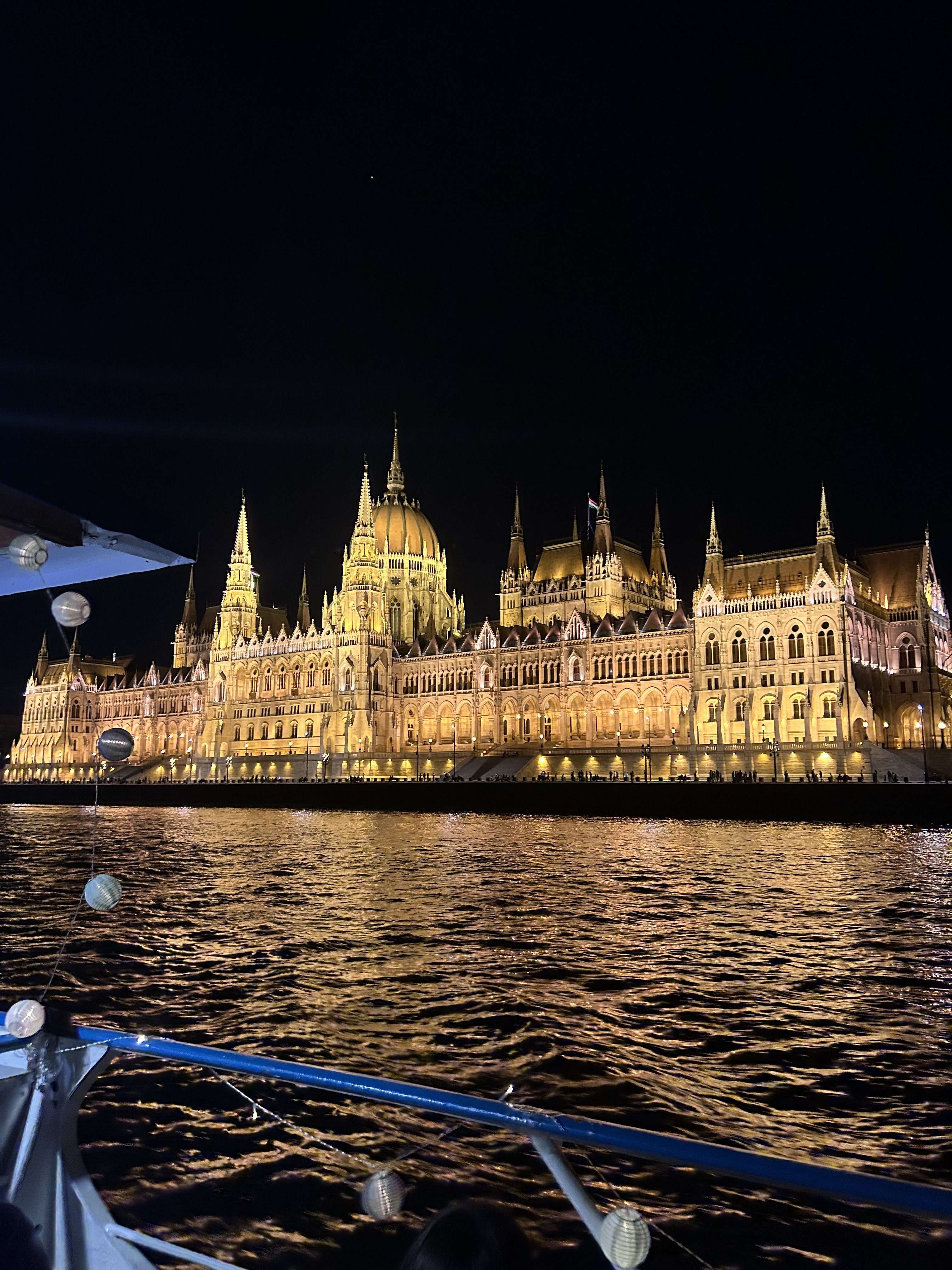 Budapest Parliament illuminated at night.