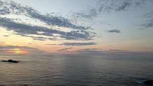 The cloudy sky on sunset over the sea.