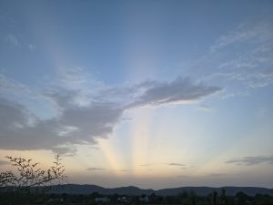 The sky is the vast space we see above Earth. It appears blue during the day because sunlight passes through Earth’s atmosphere, where blue light gets scattered more than other colors.
